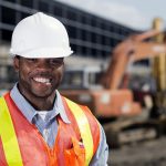 An image from the agriculture industry of a construction worker at a building site.